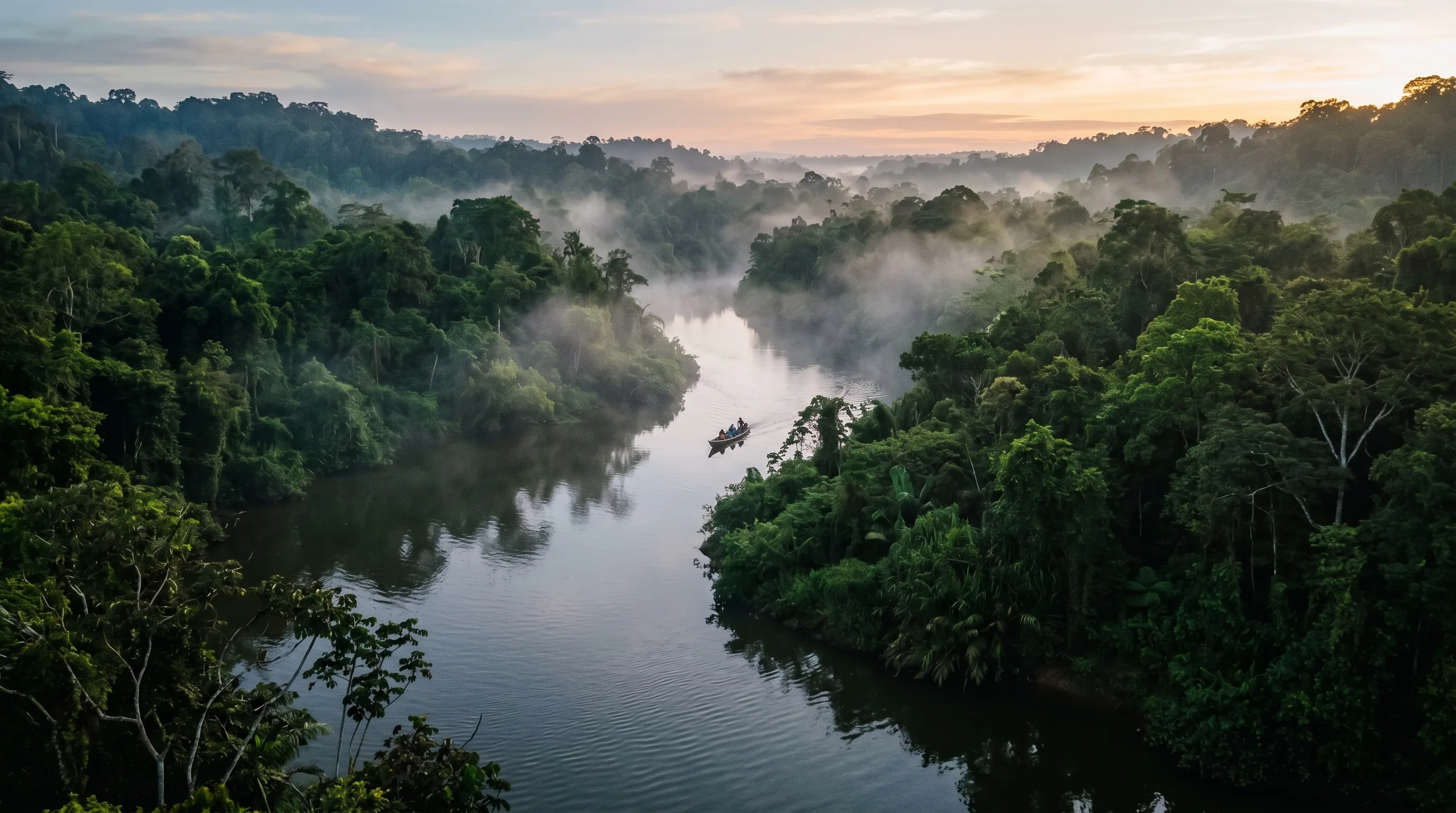 The Kinabatangan River winding through dense rainforest in Sabah, Malaysian Borneo, at dawn