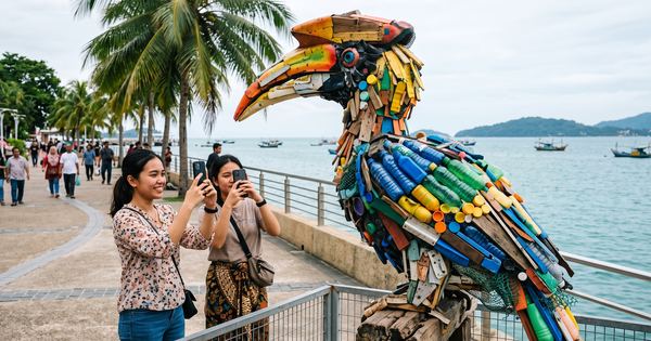 Large outdoor art installations made from recycled material along a city waterfront boardwalk