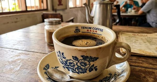 Illustration of a cup of Tenom coffee in a kopitiam, not a photo of the festival